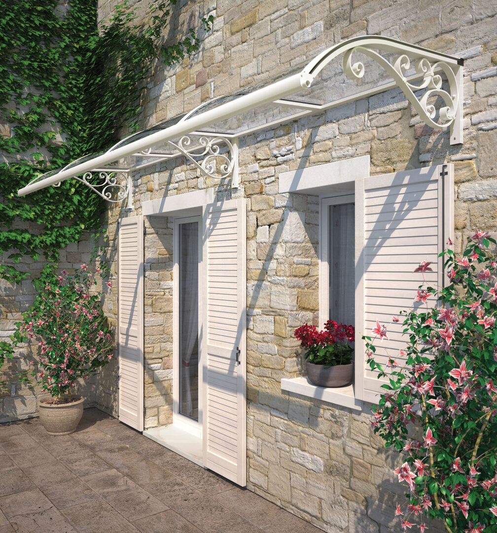 Photo of a Feeney awning, shown in white, sheltering a home's back entryway.