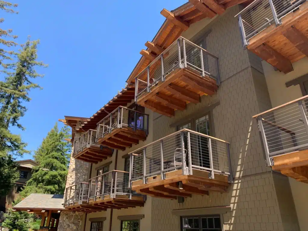 Pathway around the lodge showcasing the redwood inspired balconies.