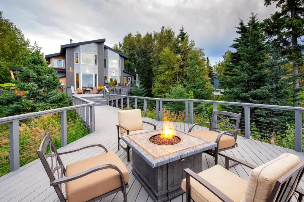 Large bright colored wood deck featuring CableRail overlooking the Alaska scenery.